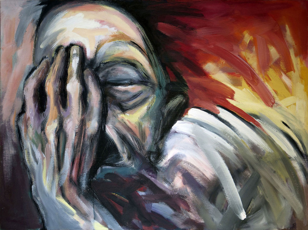 Mann mit Hand vor dem Gesicht